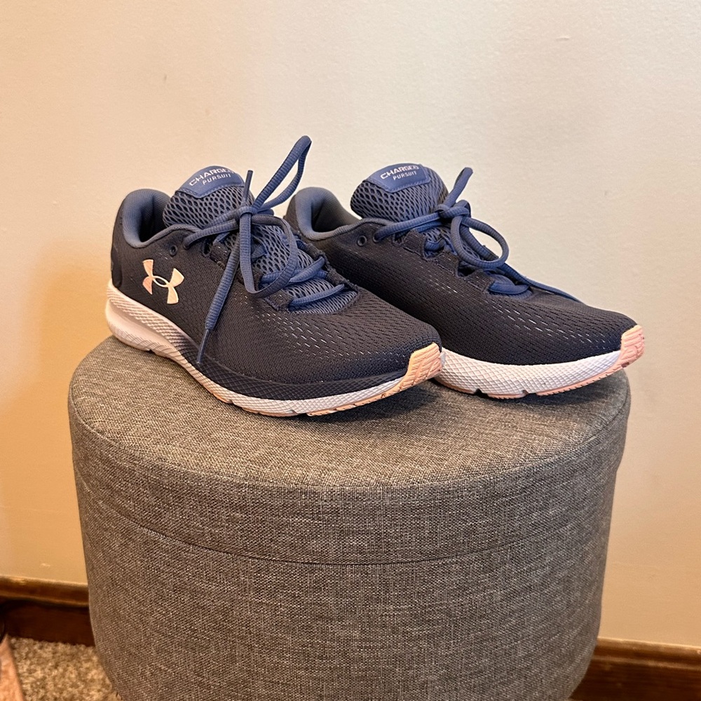 Women’s UA Charged Pursuit running shoes.